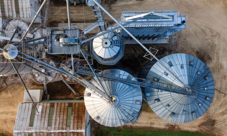 Drone shot of metal grain silos in Utica, MN, showcasing industrial agriculture. - Photo by Tom Fisk on Pexels